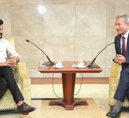 Telangana Chief Minister A. Revanth Reddy and Singapore Foreign Minister Vivian Balakrishnan shake hands during a meeting.