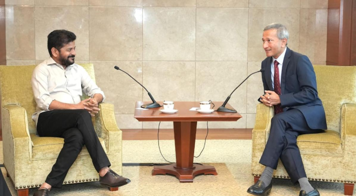 Telangana Chief Minister A. Revanth Reddy and Singapore Foreign Minister Vivian Balakrishnan shake hands during a meeting.