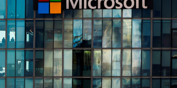 Microsoft and Activision Blizzard logos displayed on screens, symbolizing the finalized $69 billion acquisition deal.