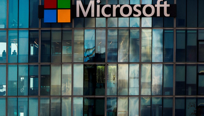 Microsoft and Activision Blizzard logos displayed on screens, symbolizing the finalized $69 billion acquisition deal.