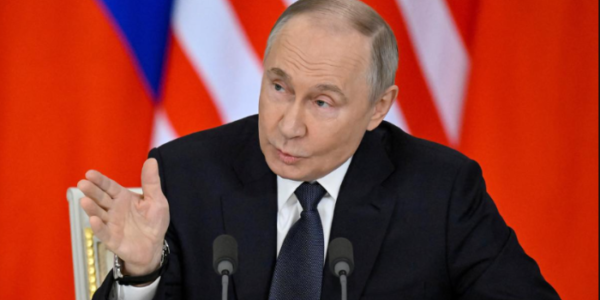 https://theeconomicinfluence.com/Russian President Vladimir Putin during a formal government announcement in May 2025