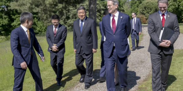 US and Chinese officials in Geneva discussing trade relations during a tense diplomatic exchange amid semiconductor disputes.
