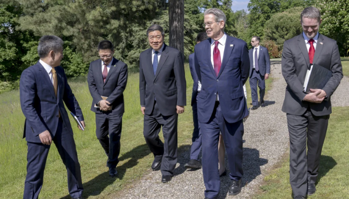US and Chinese officials in Geneva discussing trade relations during a tense diplomatic exchange amid semiconductor disputes.