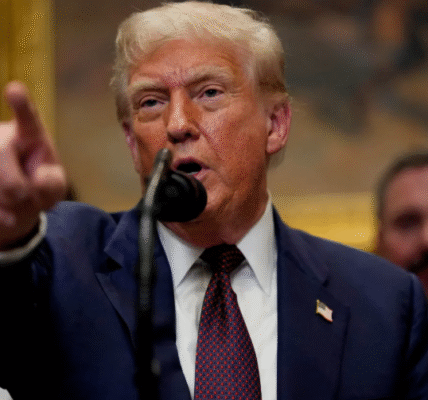 Donald Trump speaks and points during a press briefing in Washington D.C.
