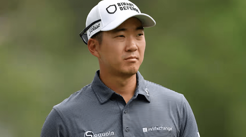Michael Kim celebrating a PGA Tour victory, highlighting leadership and economic influence in professional golf