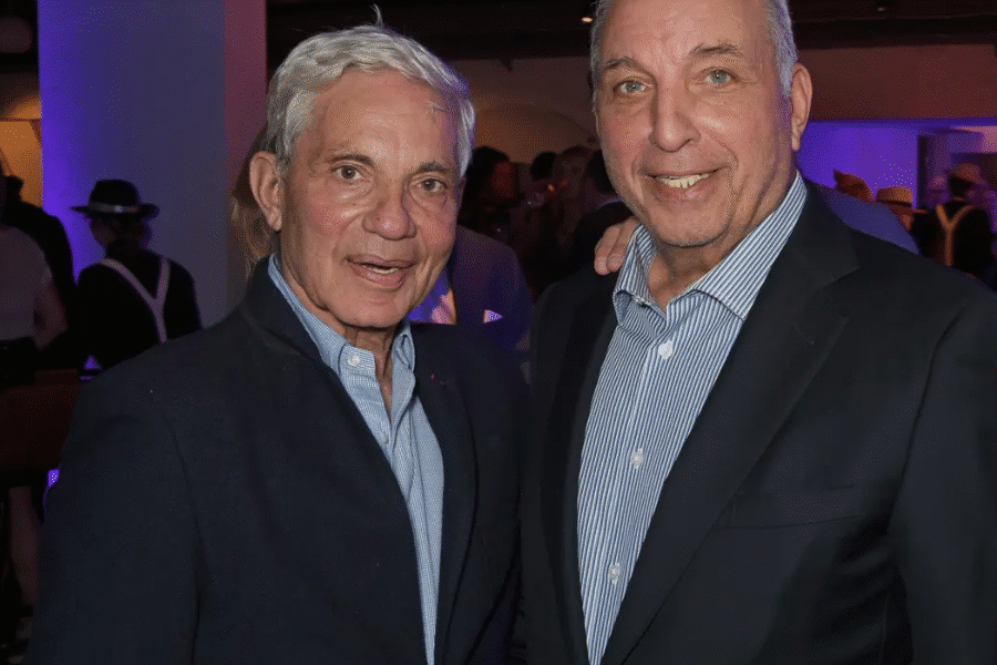 David and Simon Reuben standing together, exemplifying leadership and economic influence through global investments and diversified portfolios