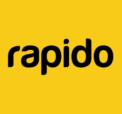 Rapido bike taxi rider navigating city traffic