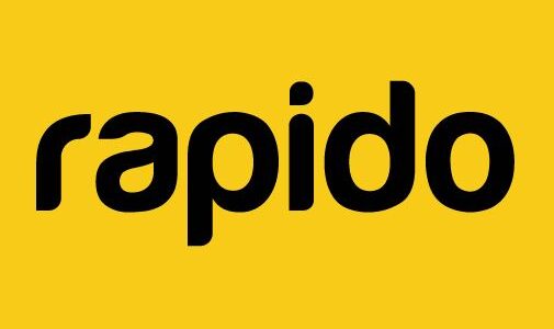 Rapido bike taxi rider navigating city traffic