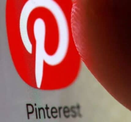 Pinterest app icon on smartphone representing company layoffs and employee tracking