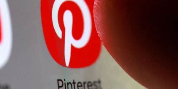 Pinterest app icon on smartphone representing company layoffs and employee tracking