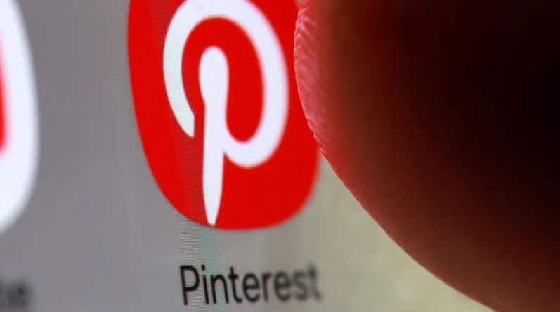 Pinterest app icon on smartphone representing company layoffs and employee tracking