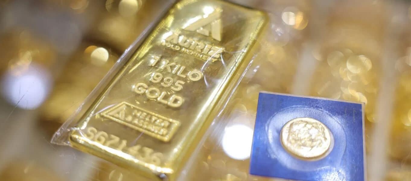 Gold and silver bars displayed at a jewelry store, showing rebound in precious metals prices, 2026.
