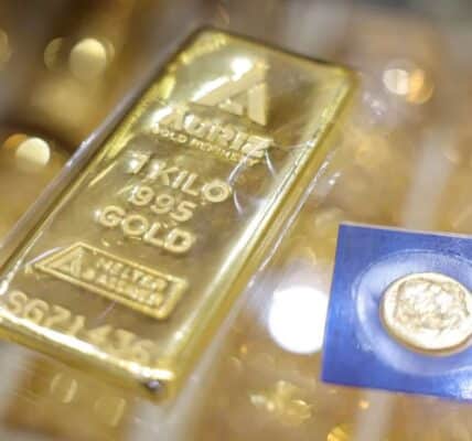 Gold and silver bars displayed at a jewelry store, showing rebound in precious metals prices, 2026.